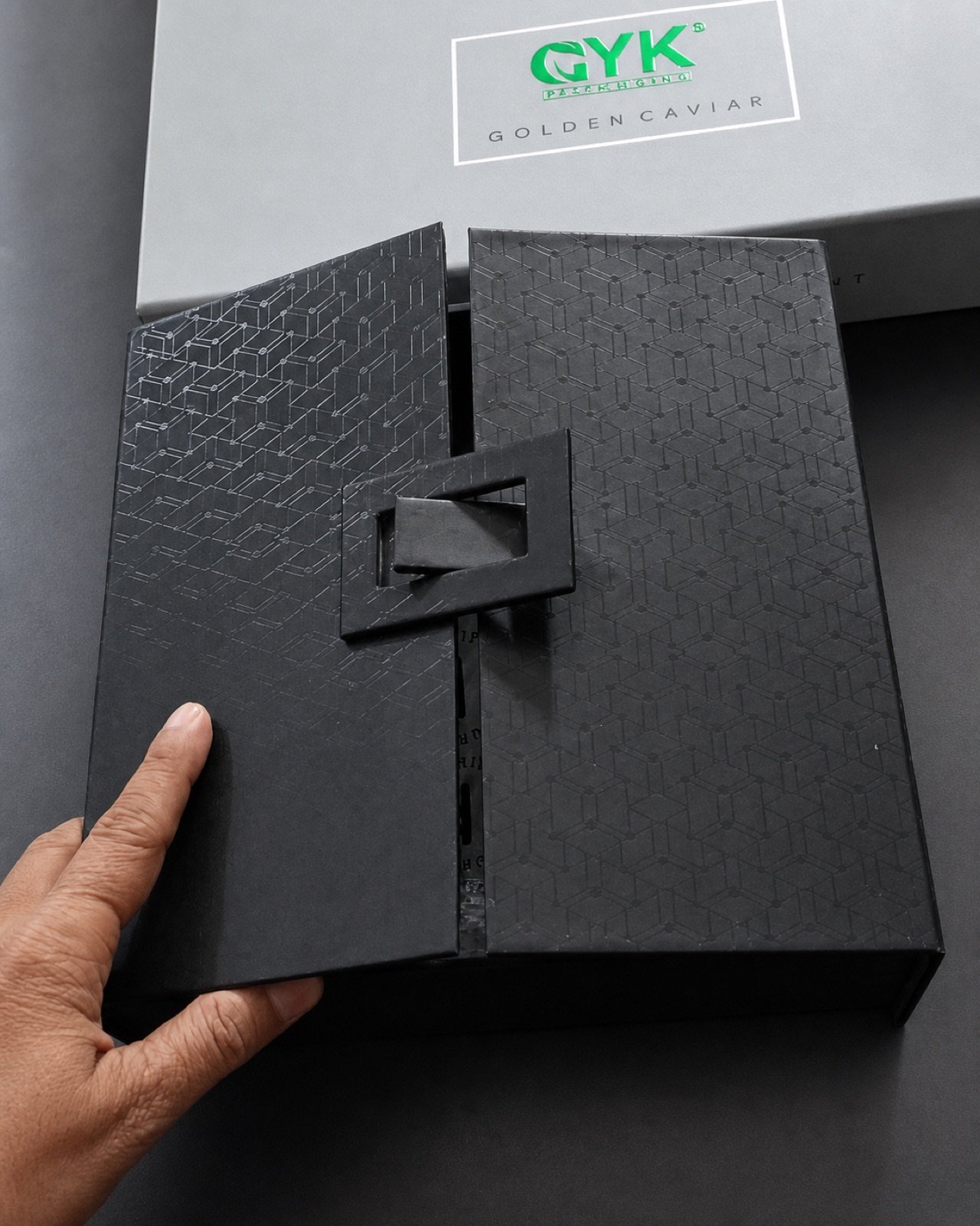 Black special-opening rigid presentation box with a fitted product area
