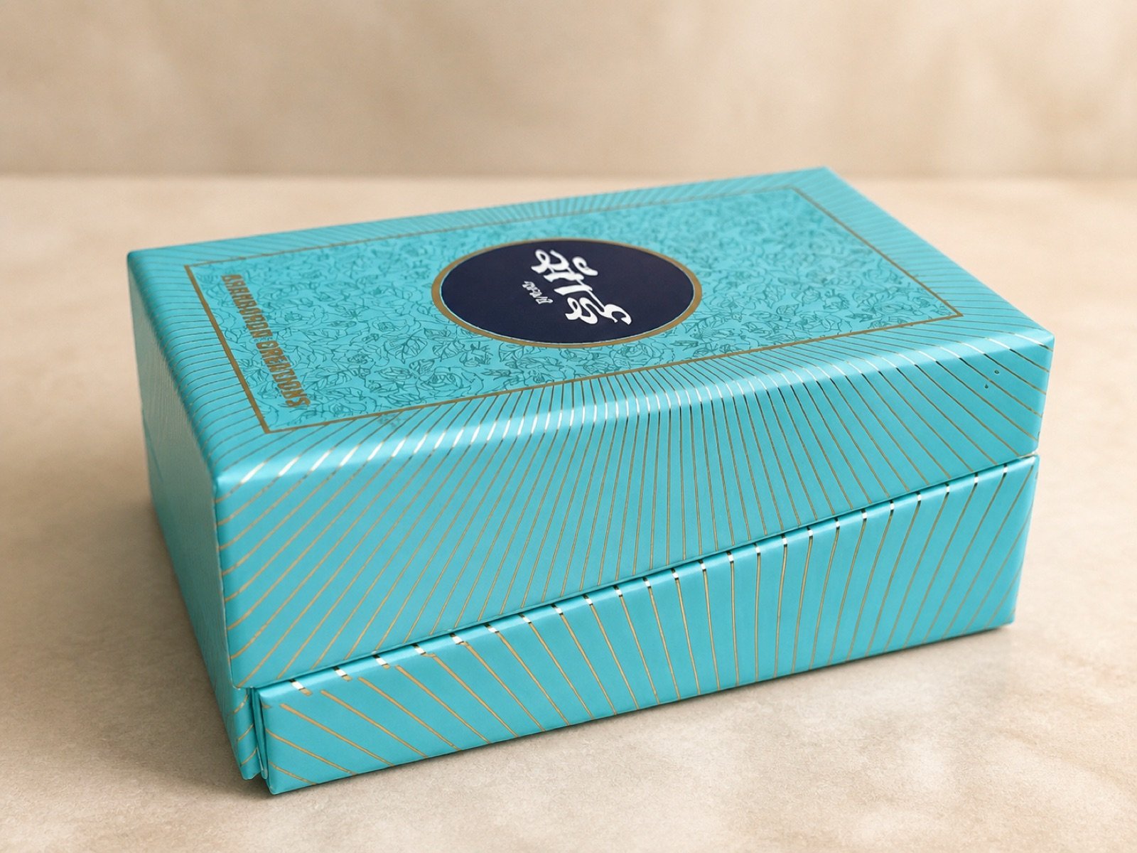 Turquoise rigid box with detailed gold line printing