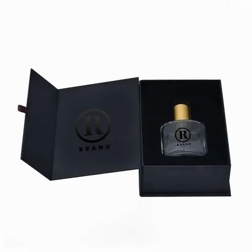 Black book-style rigid box with a subtle pressed logo