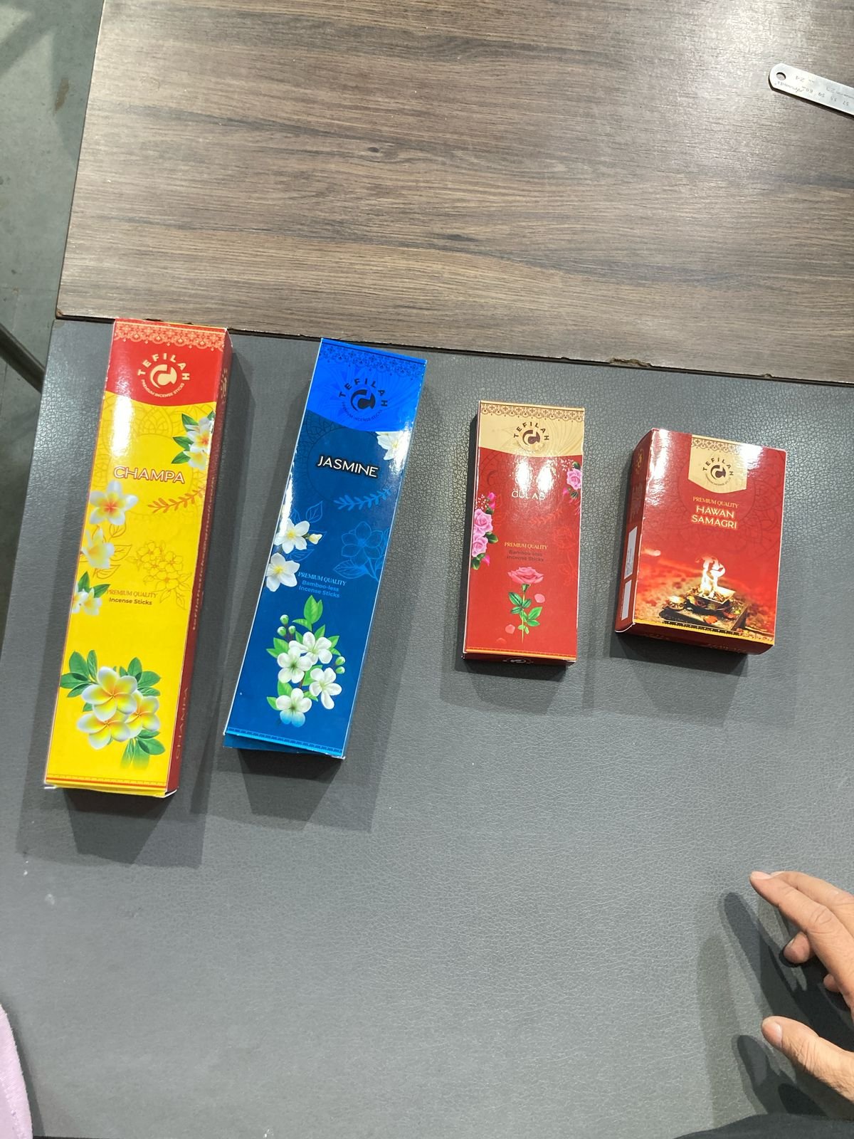 Colourful printed incense cartons in bright red blue and yellow