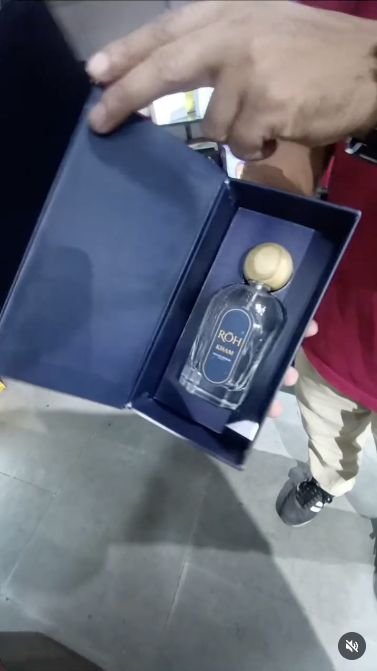 Open navy perfume presentation box from Printing Material’s project reel